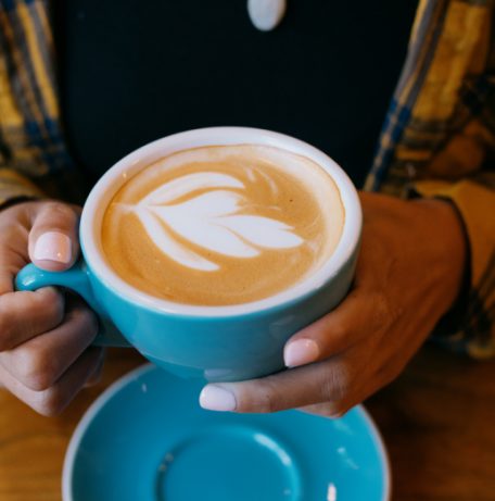 Hands holding coffee